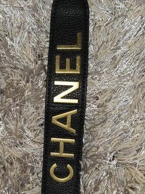 CHANEL Black Leather Strap with Gold Logo Letters